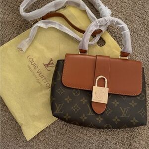 Brand new bag, but came in with scratch on buckle